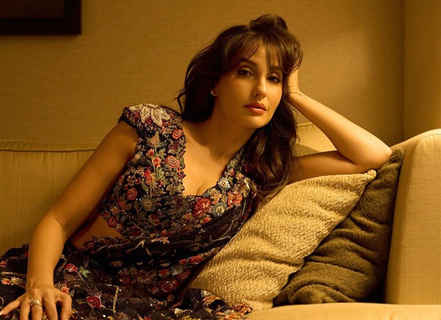 Bollyhungama's tweet card. The streets of Shillong are buzzing with excitement as a massive billboard featuring global sensation Nora Fatehi alongside The Script, Diplo, Tyga