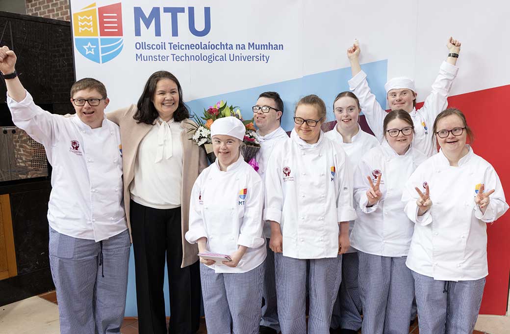 TeamInclude's tweet card. Innovative food & hospitality programme for students with Down Syndrome at MTU. Simon Coveney T.D. presented awards at a graduation...