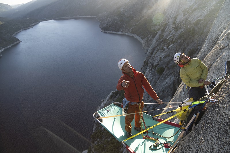 HetchHetchy's tweet card. Timmy O'Neill and Lucho Rivera high on Hetch Hetchy Dome. The mild weather was ideal for climbing but made for a chilly night on the exposed wall. (Photo James Q Martin)