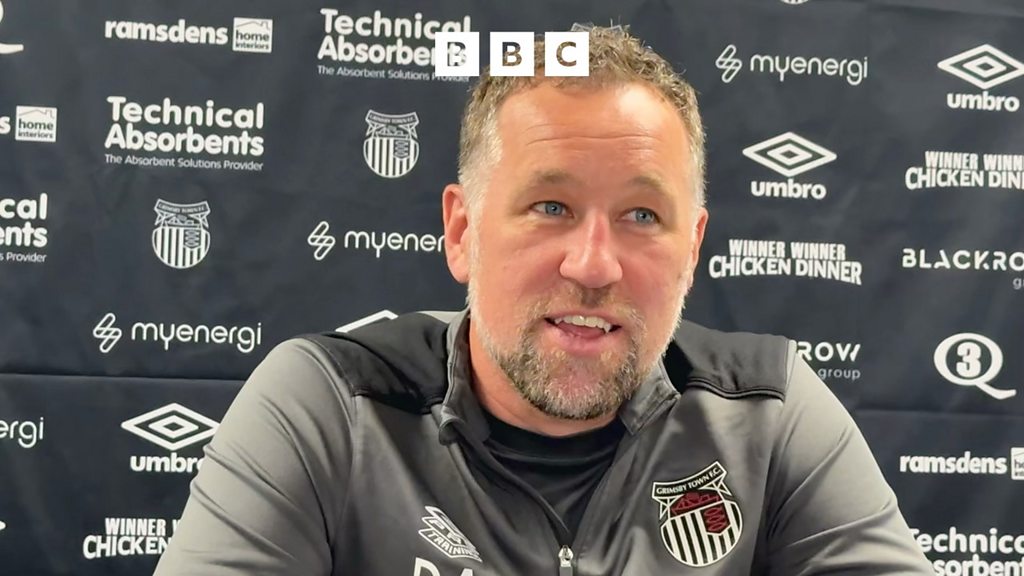 HumbersideSport's tweet card. Matt Dean talking to David Artell after Grimsby's 2-2 draw at Barrow.