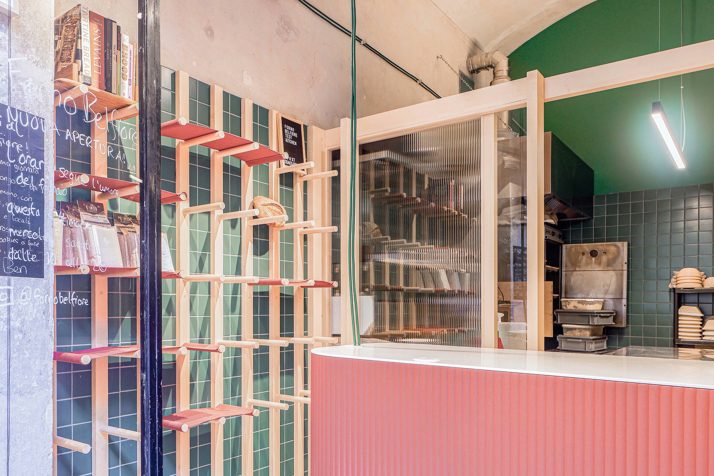 urdesignmag's tweet card. Exploring Davide Minervini's compact interior design for Forno Belfiore, an artisanal bakery in Turin's San Salvario. Discover how a 25m² space uses transparent partitions, natural materials, and...