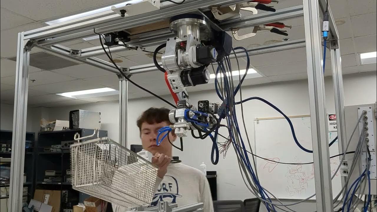 Assistabotics's tweet card. Robot picking up fry basket- Restaurant automation