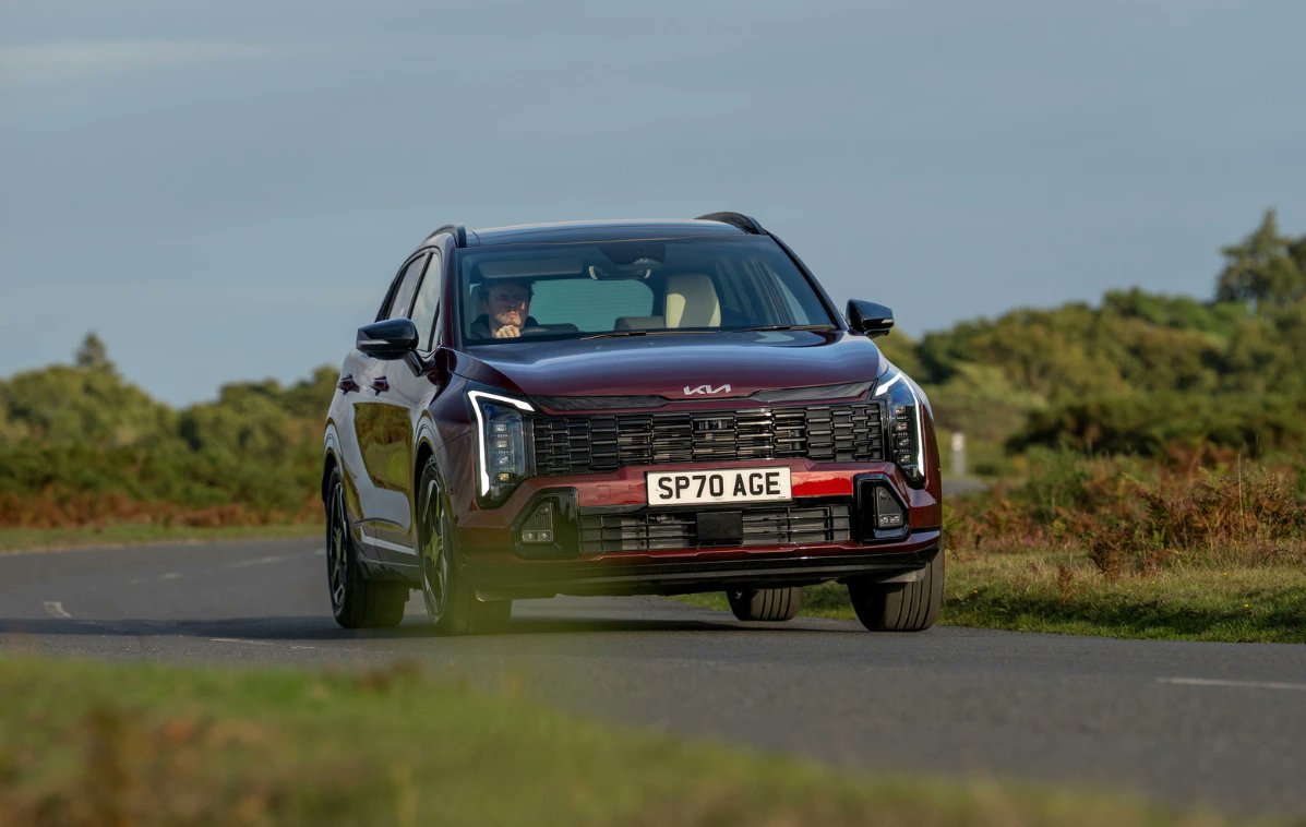 the_interface_'s tweet card. Kia Sportage is the best selling car in the UK for September 2025