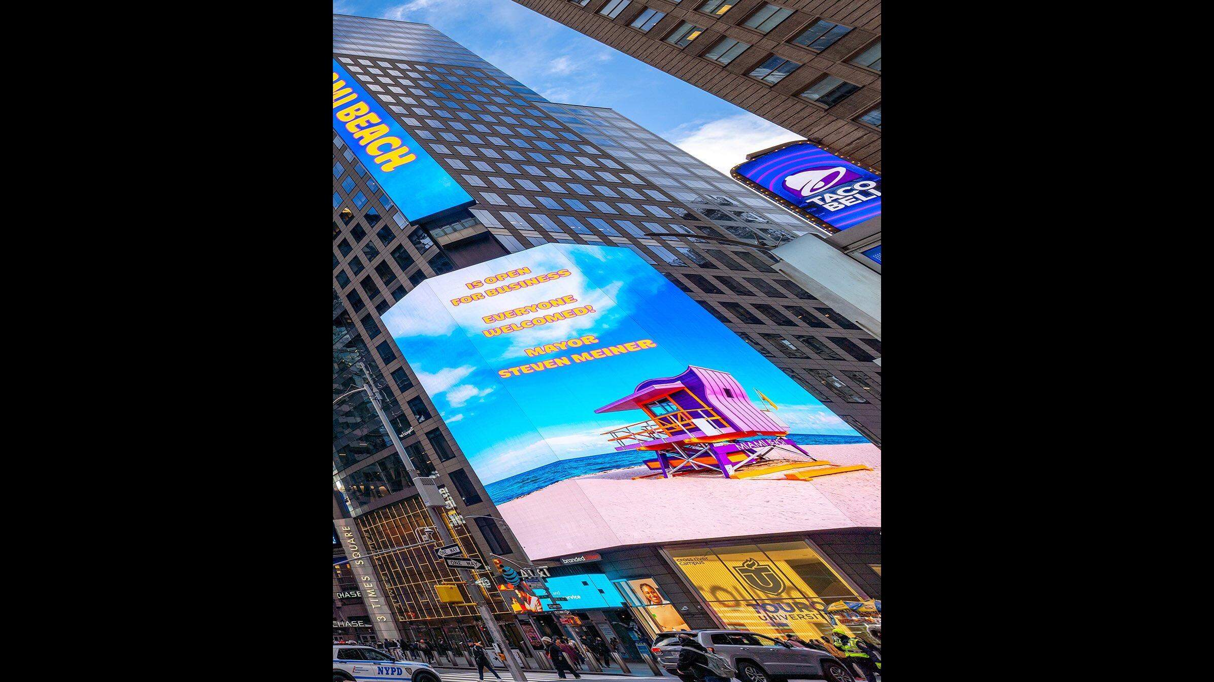 DavidJNeal's tweet card. A prominent developer paid for Times Square billboards in which Miami Beach Mayor Steven Meiner encouraged New Yorkers to come to his city.