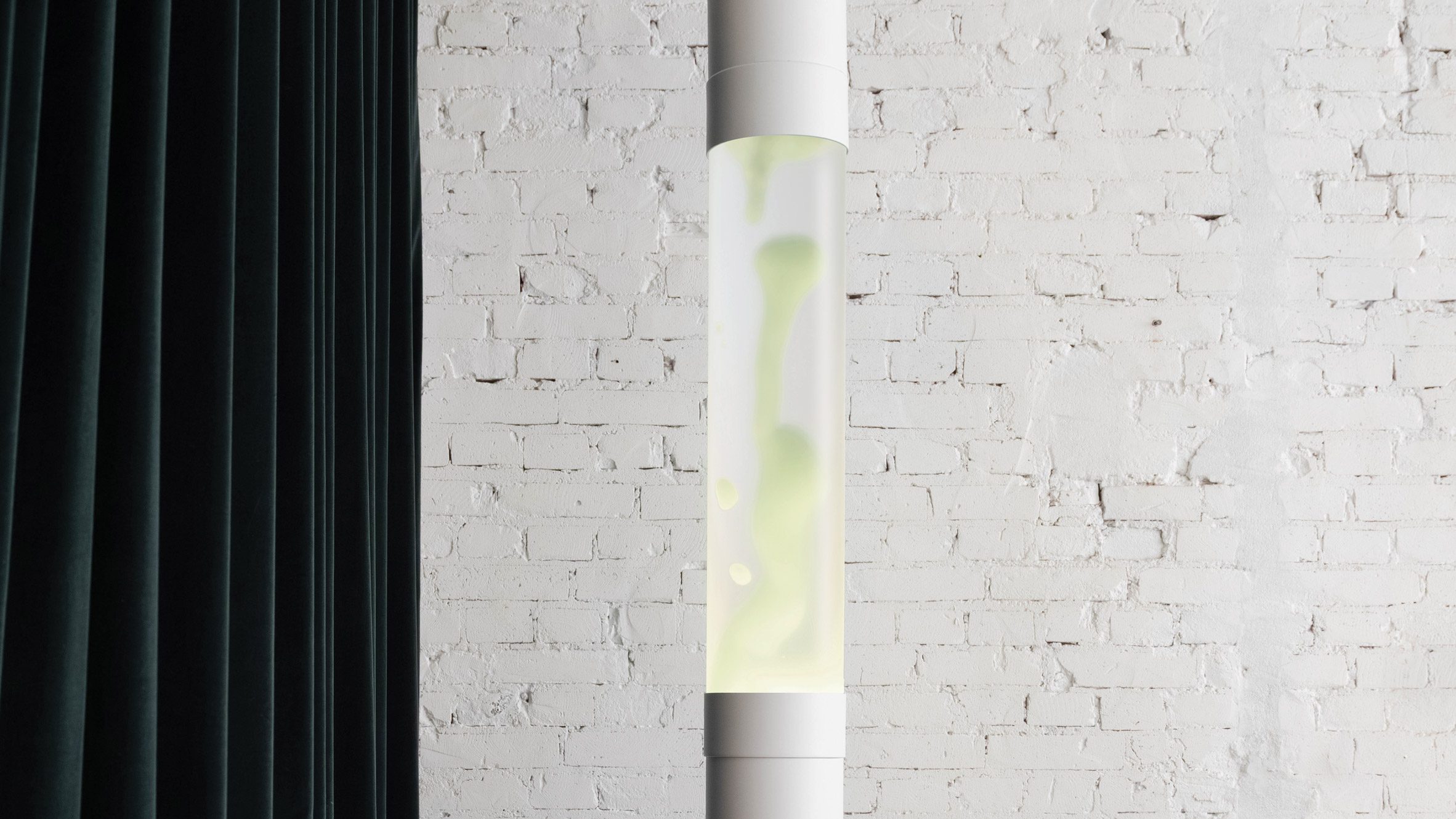 VitalizeOne's tweet card. This modern interpretation of the original Lava Lamp is a clean, tall column, with frosted glass and a magnetic presence.