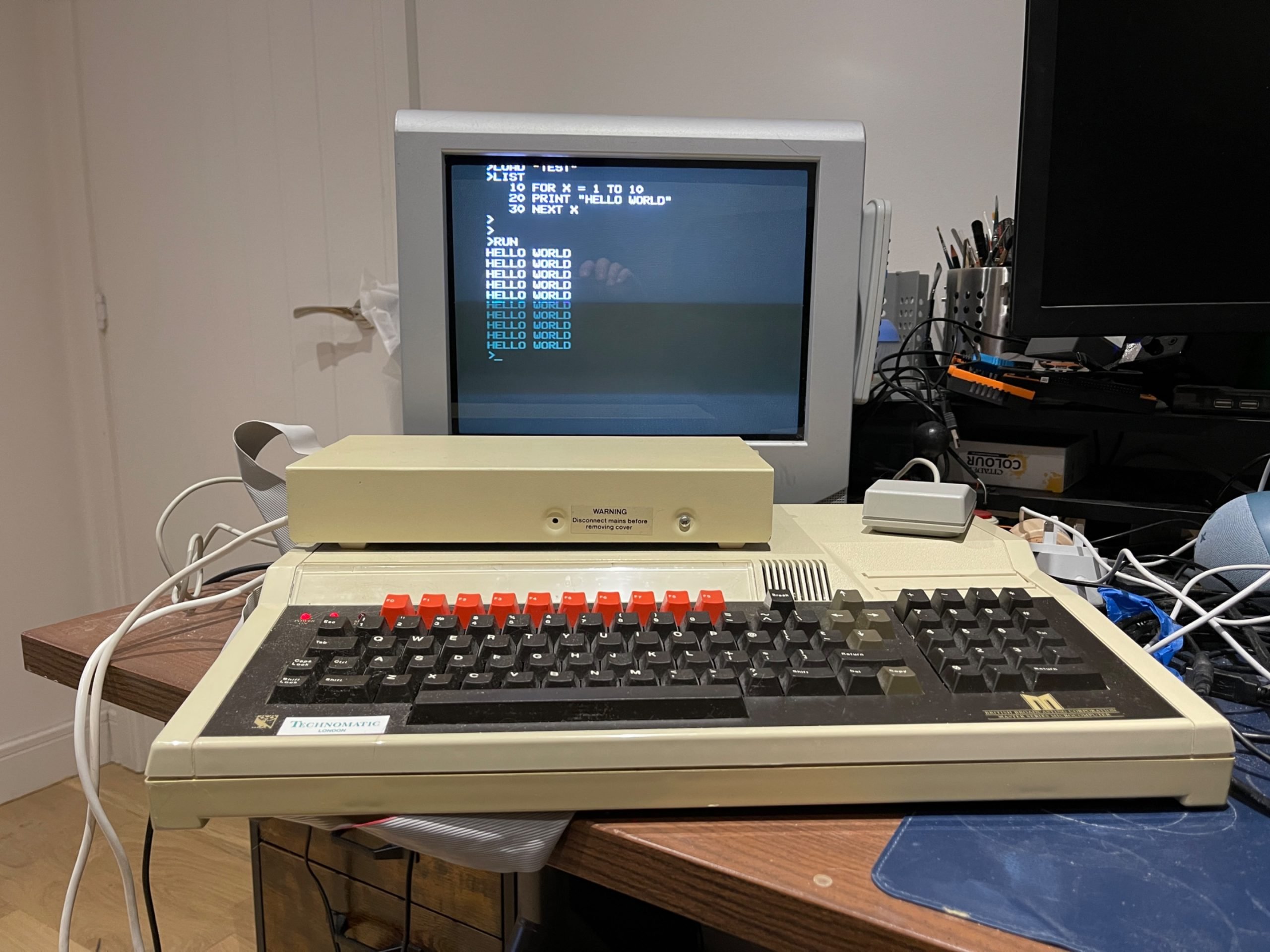 cybercaronte's tweet card. Meet my BBC Master, plus 5 1/4" floppy disk drive, and three-button mouse