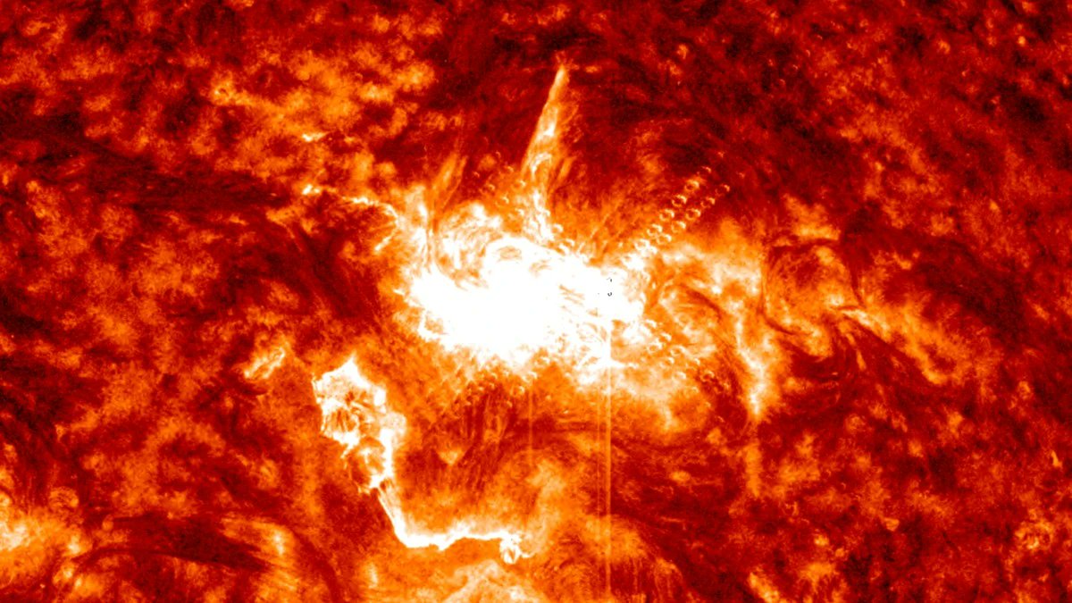 TheWatchers_'s tweet card. Proton flux rose sharply following X1.2 solar flare at 07:19 UTC on November 10, 2025, reaching S1 – Minor Solar Radiation Storm levels at 11:20 UTC.