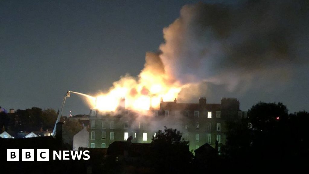 SamModlin's tweet card. Crews have the fire under control after evacuating about 50 people from the five-storey building.