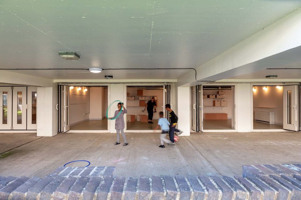 ArchReview's tweet card. Alison Crawshaw’s conversion of undercroft garages into community rooms in the Havelock Estate in Southall stands in opposition to demolition