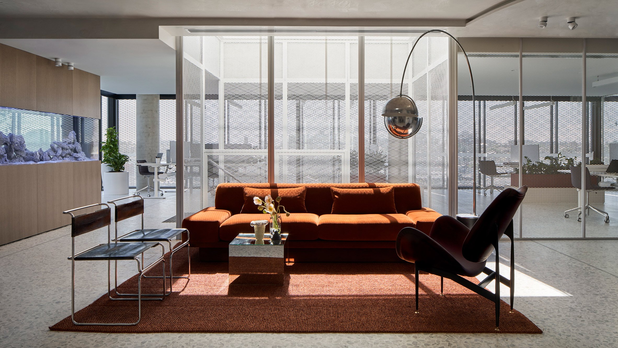 dezeen's tweet card. Perforated metal screens, glass walls and an open-plan layout help to maximise light throughout this Melbourne office, which has been overhauled by Mim Design.