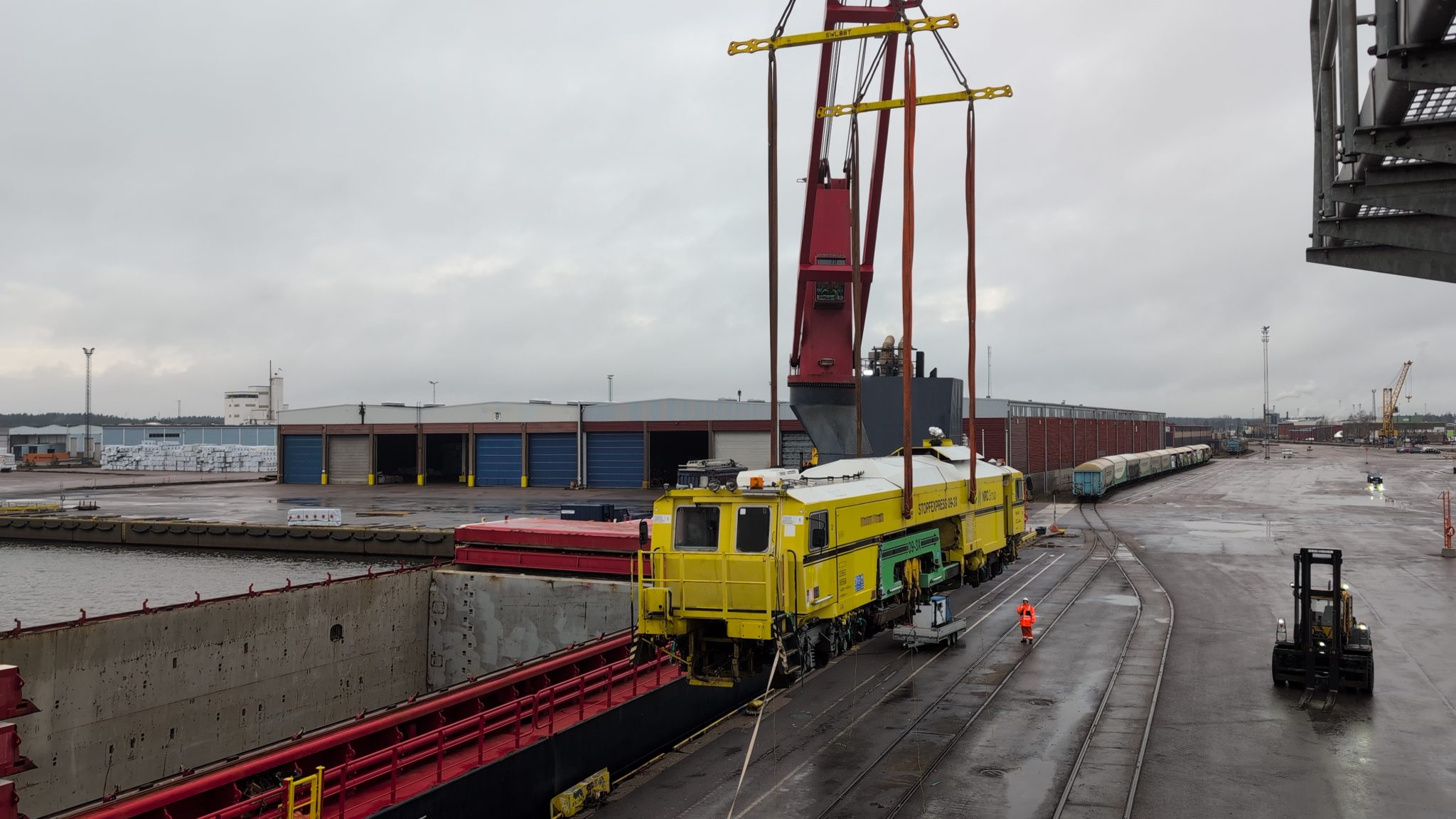 HeavyLift_News's tweet card.   Last week The Heavy Lift Group member in Finland, Hacklin Logistics, succeeded the loading of a rail track maintenance vehicle onto a vessel at the Port of Hamina, part of Finland’s largest port,...