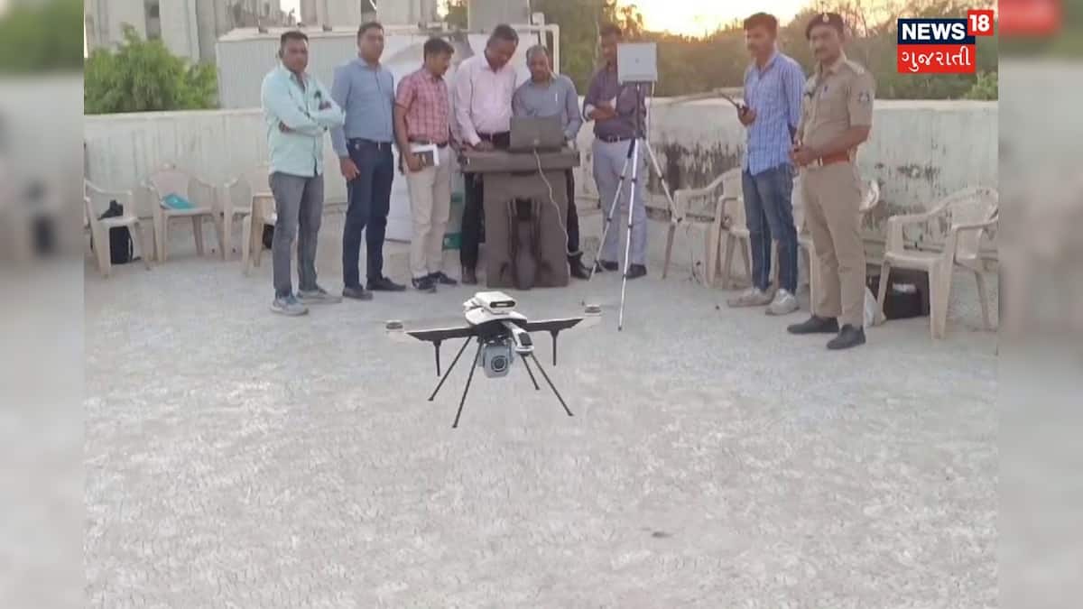 News18Guj's tweet card. ગુજરાત પોલીસ દ્વારા હવે ડ્રોનનો ઉપયોગ કરી રિસ્પોન્સ ટાઈમ ઘટાડવા ‘GP – DRASTI’ નામનો ખાસ પ્રોજેક્ટ શરૂ કરવામાં આવ્યો છે. જેથી હવે કોઈ પણ ઘટનાની જાણ થતાં જ પોલીસ કંટ્રોલ રૂમ દ્વારા ડ્રોન બેઝ સ્ટેશનને...