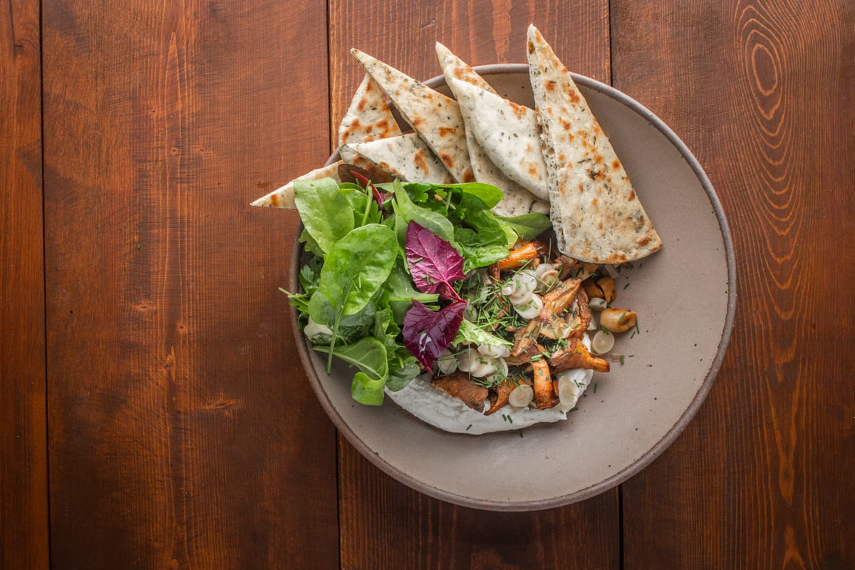 AlanBergo's tweet card. Sauteed mixed wild mushrooms with soft goat cheese, warm herbed flatbreads and a green salad is a great shareable appetizer that comes together quickly after a long day in the woods.