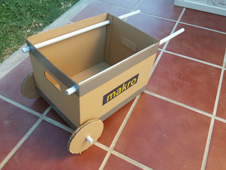 BoxitCPT's tweet card. Rather than buying a cheaply made toy wheelbarrow for his toddler son, Alfonso made his own out of cardboard, in 5 minutes.