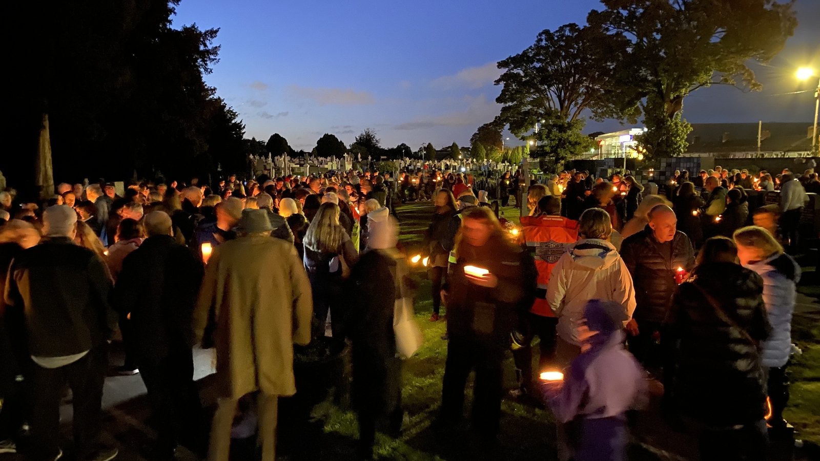 rtenews's tweet card. Hundreds of people have attended a candlelit vigil in Deansgrange Cemetery to protest against plans to put a cycle route through the graveyard.