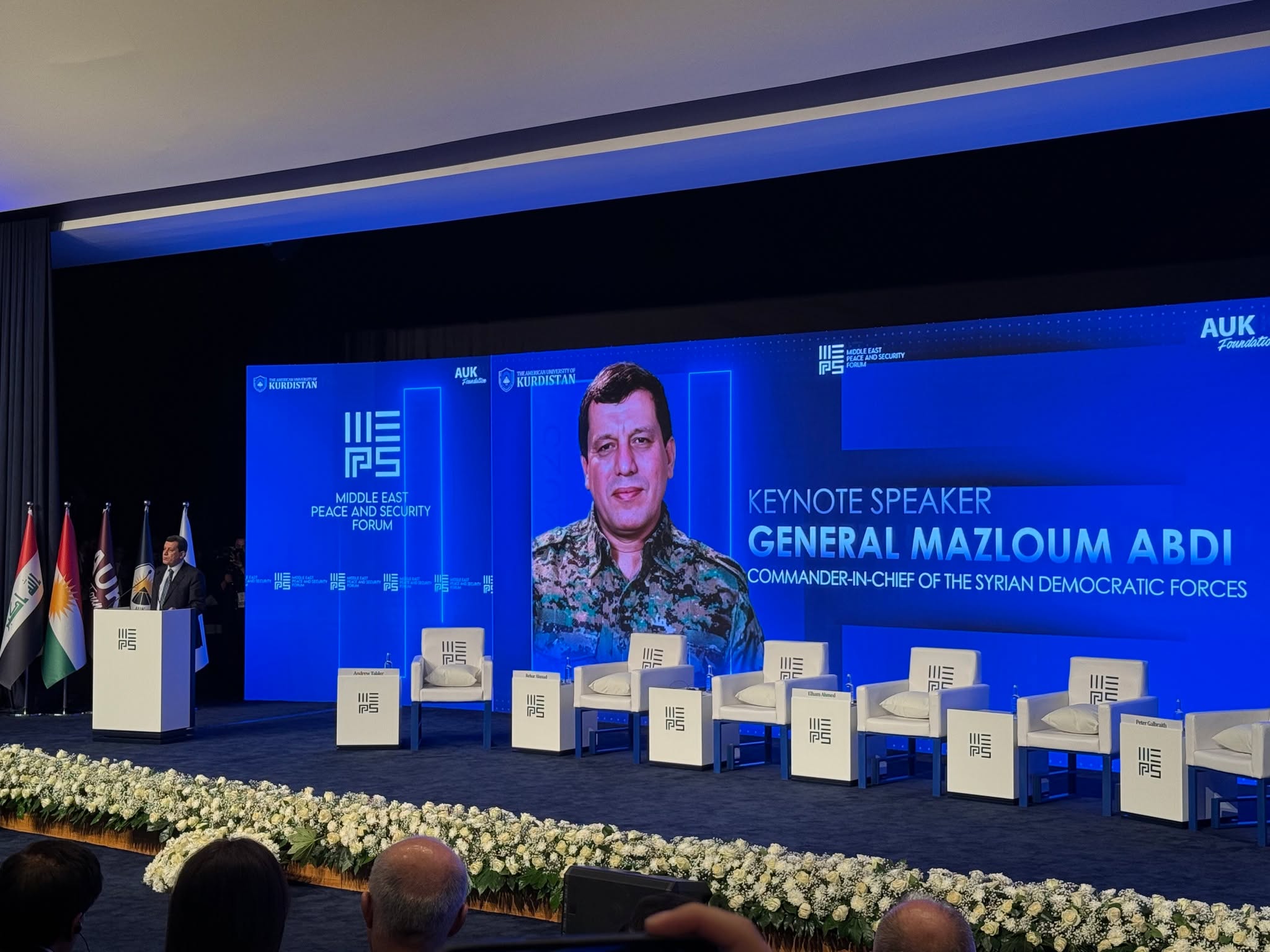 PYD_Rojava's tweet card. أكد القائد العام لقوات سوريا الديمقراطية مظلوم عبدي خلال مشاركته في منتدى السلام والأمن في الشرق الأوسط (MEPS 2025) في