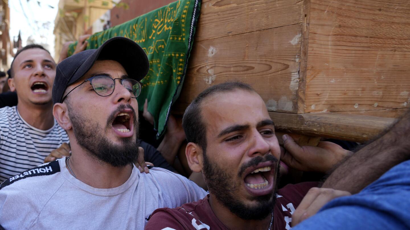 bmroue's tweet card. Thousands of Palestinians have held prayers in a small football field in a refugee camp in northern Lebanon for one of the scores of migrants who lost their lives this week when their boat sank off...