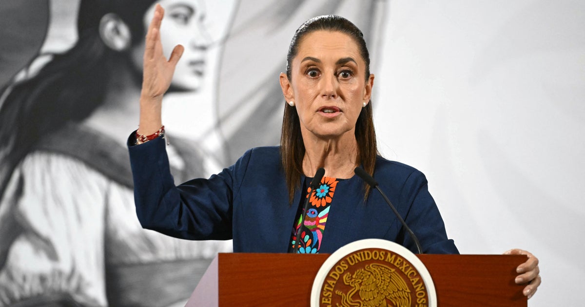 HolyGhostShell's tweet card. The signs read in English and Spanish, "Warning: Restricted Area," and had been declared restricted by "the commander."