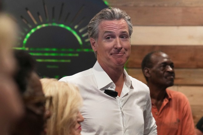 RealLibSmacker's tweet card. Gavin Newsom's climate deal with Nigeria sparks controversy amid Christian persecution.