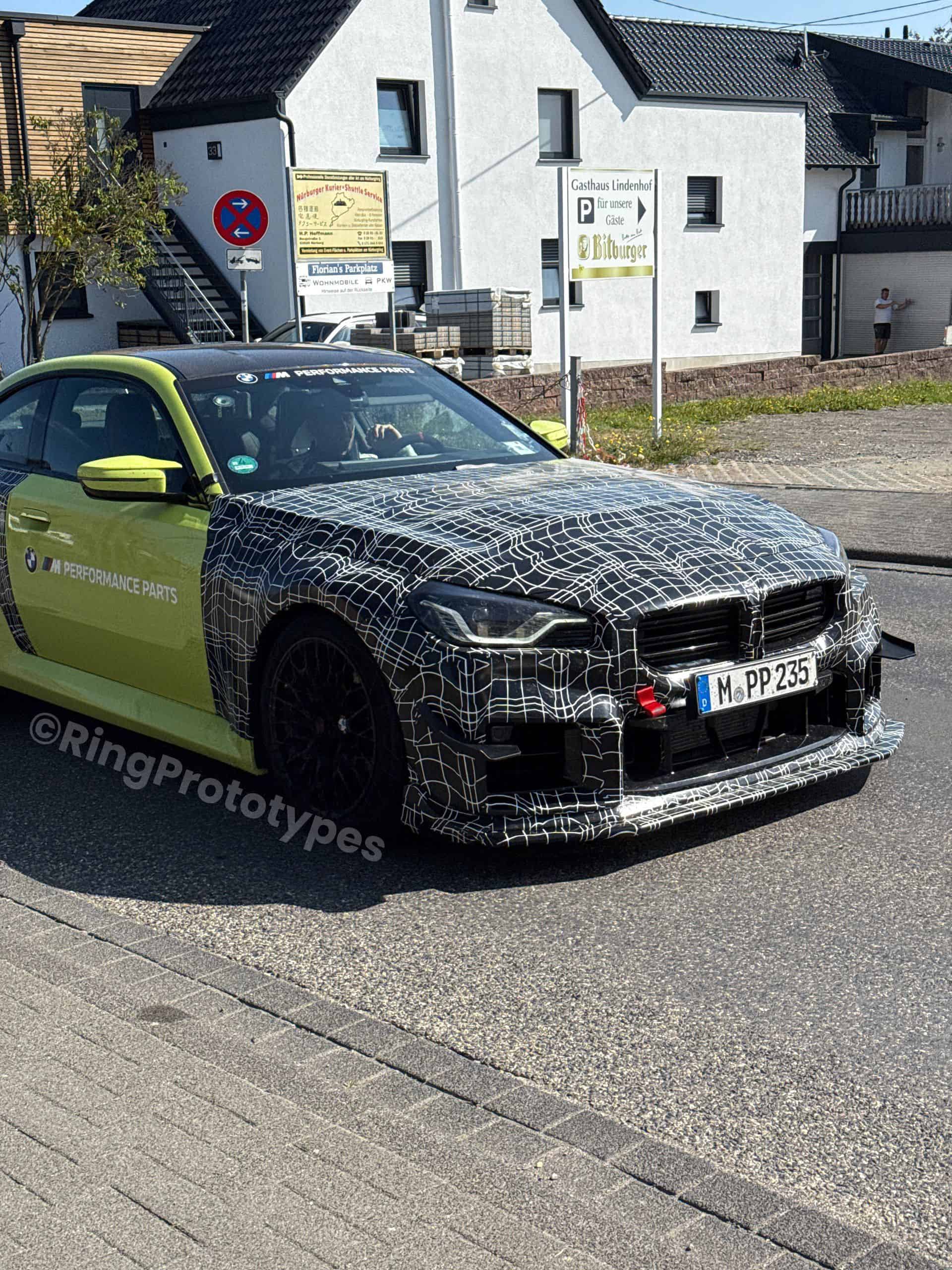 bmwblog's tweet card. Ahead of next year's release, the road-legal BMW M2 Track Package has been spotted flaunting a massive rear wing and large front canards.