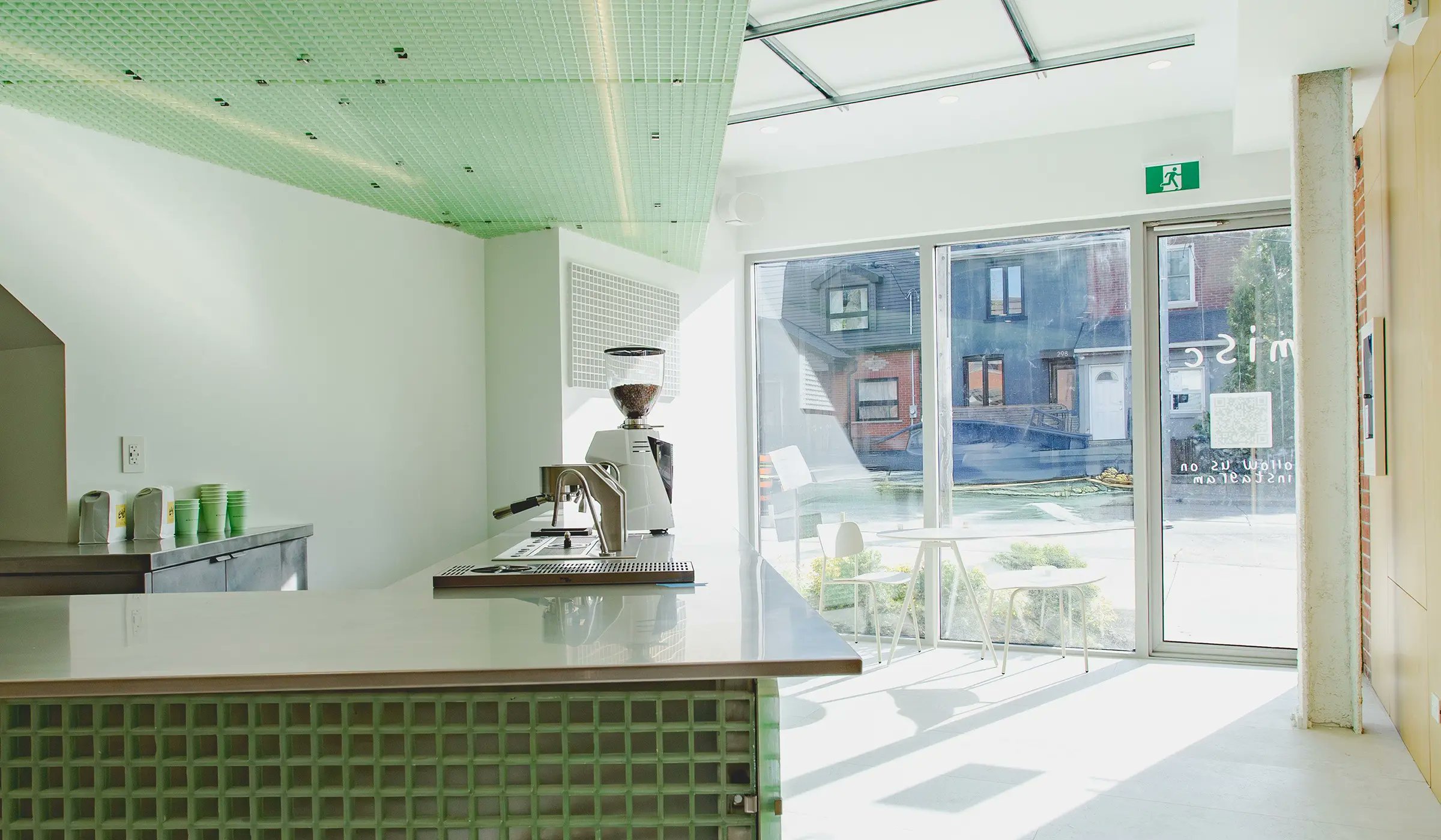 urdesignmag's tweet card. Misc Coffee redefines industrial materials. StudioAC employs green FRP panels and Unistrut channels for a unique, minimalist Toronto cafe design.