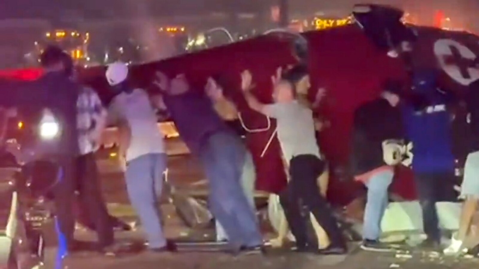 NewsCali's tweet card. The new video shows more than a dozen drivers and other good Samaritans rushing to the wreckage of the helicopter, lining up and lifting the aircraft.