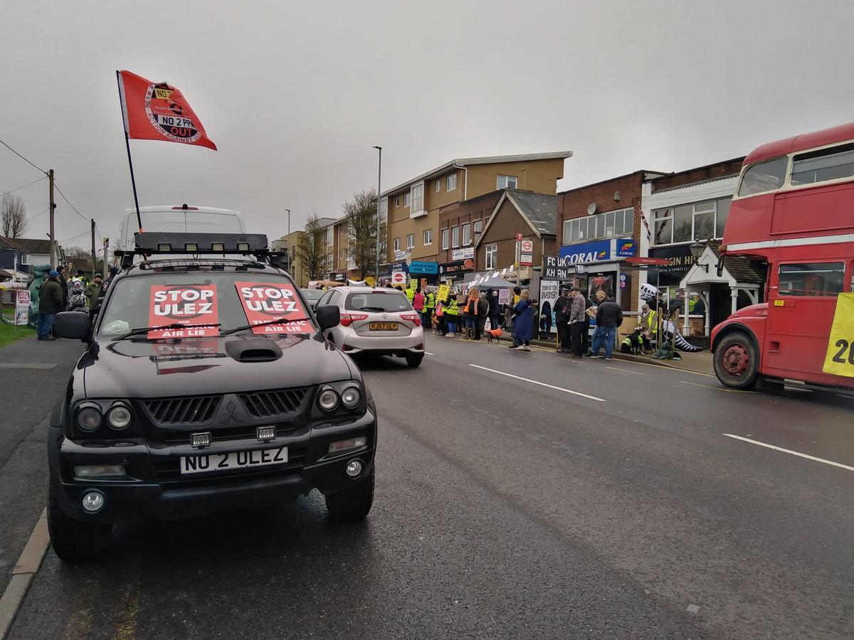 AntiExtension's tweet card. Around 500 protesters, some dressed as skeletons and t-rexes declared “Ulez is dead” at an event in Biggin Hill
