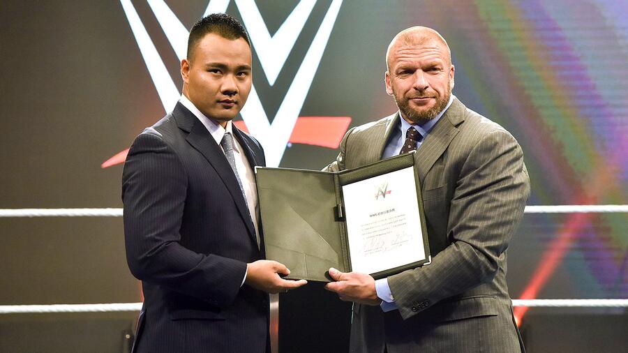 WWE's tweet card. Triple H introduces WWE's first Chinese talent signing, Bin Wang