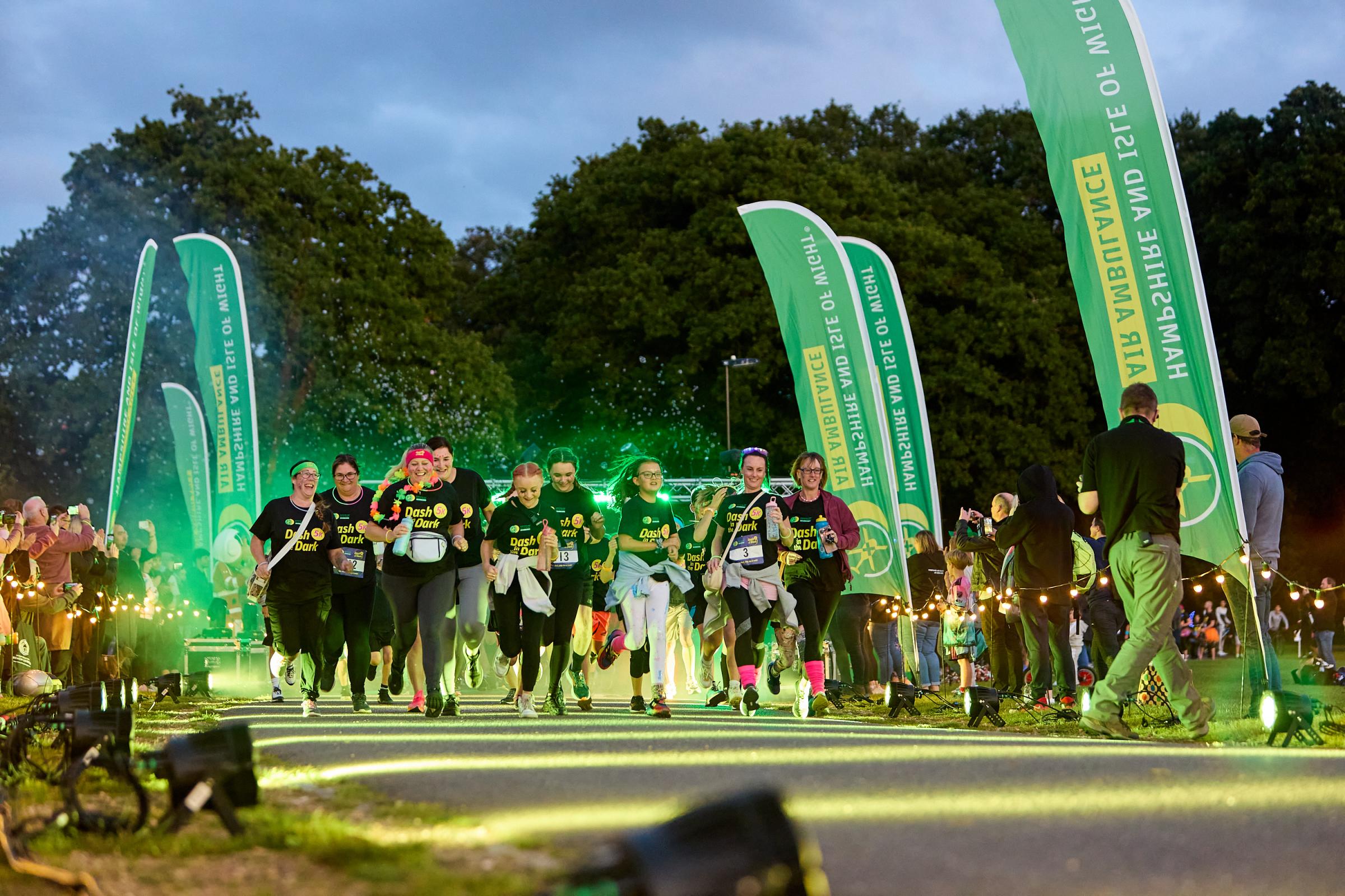 HIOWAA's tweet card. 750 neon-clad runners raised £30,000 for Hampshire and Isle of Wight Air Ambulance during the annual Dash in the Dark on Southampton Common