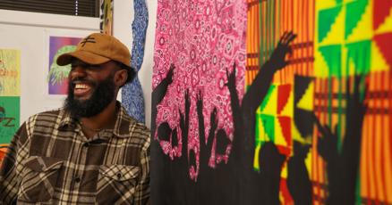 scrapa2020's tweet card. The smell of paint fills the room as hip-hop beats through headphone speakers. Canvases are spread across the floor and rough sketches line the walls.