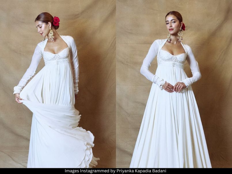 THEOFFICIALB4U's tweet card. Ananya Panday served festive minimalism in a flowing ivory Anarkali, styled with chaandbaalis, red roses, and glowing soft glam.