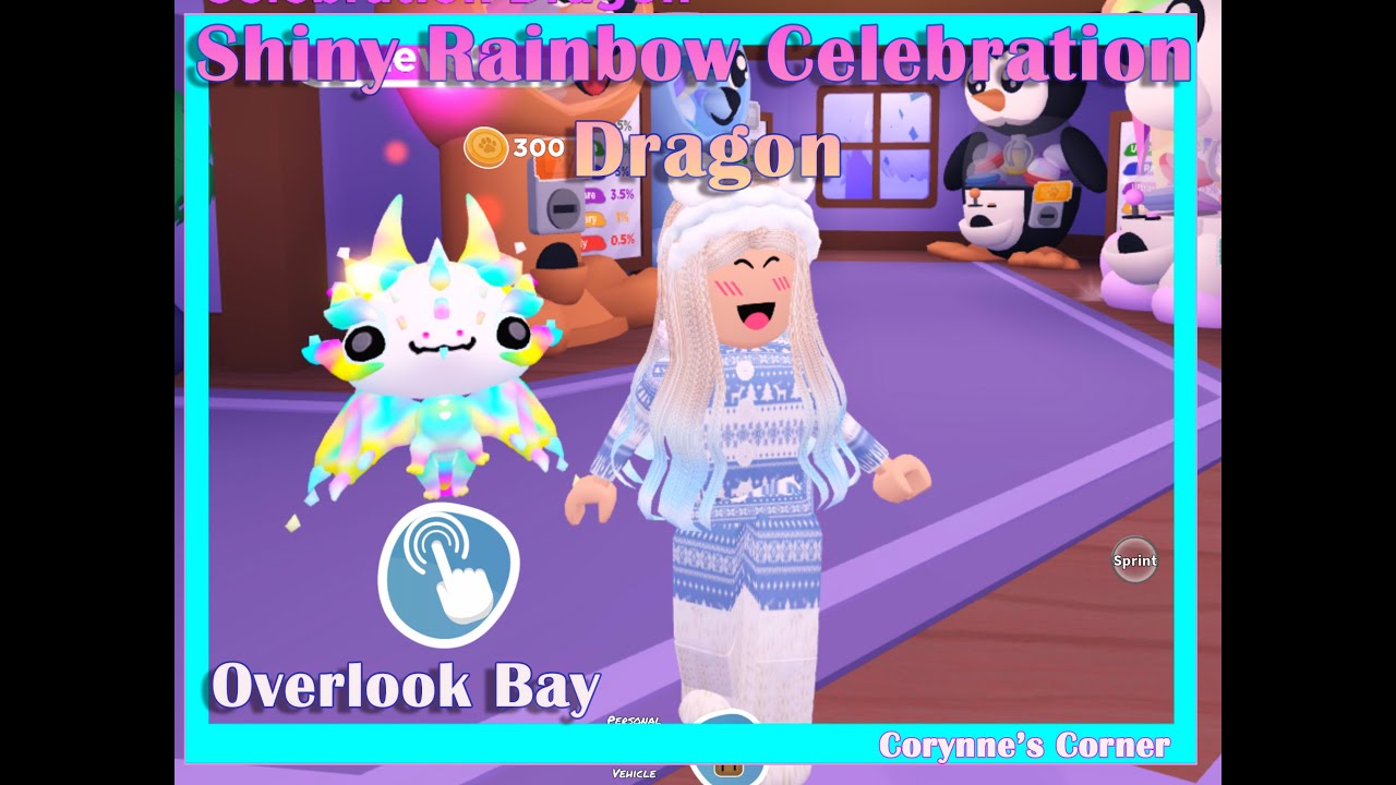 Roblox_Lady_M's tweet card. Overlook Bay Shiny Rainbow Celebration Dragon and Gingerbread house...