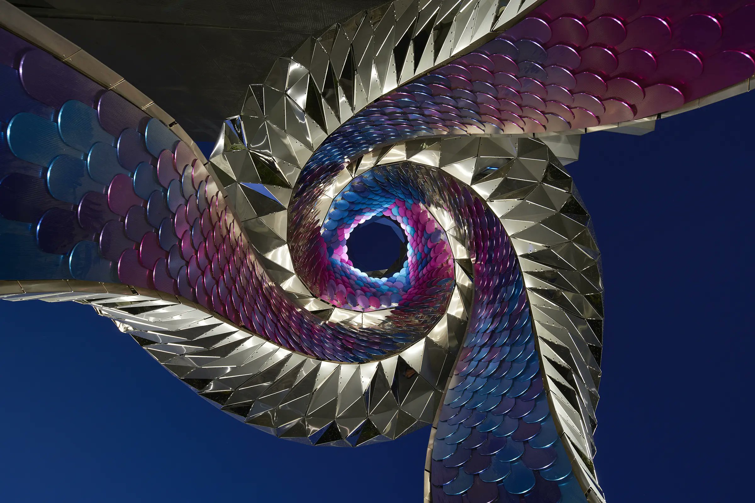 urdesignmag's tweet card. FUTUREFORMS' 34-foot-tall Orbital sculpture connects digital craft, geometry, and public space in Mission Bay, San Francisco.