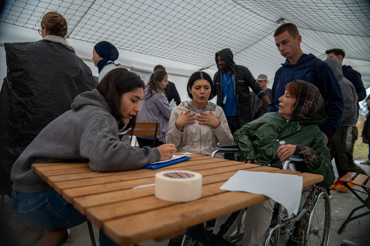 UNmigration's tweet card. Ciolpani, Romania — “When I started out in the field, my handover lasted thirty minutes on an airport tarmac before I had to run a food…