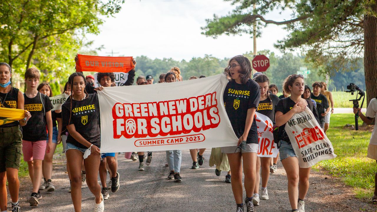 sunrisemvmt's tweet card. “We’ll be marching, taking over our school buildings, and walking out.”