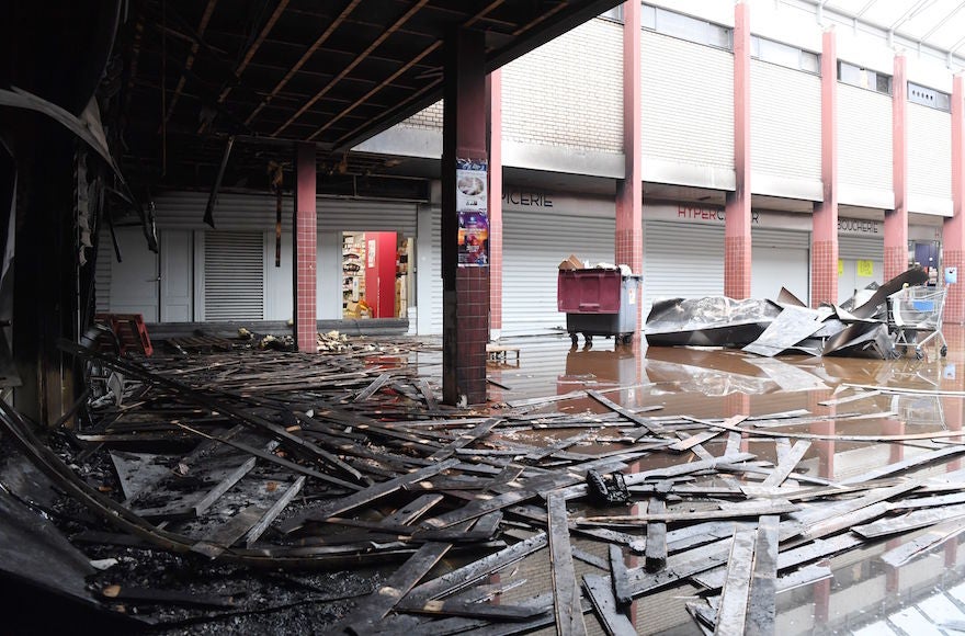 Official_SCN's tweet card. The regional prosecutor’s office told the AP that they were treating the fire as a criminal act because the store’s protective shutters had been forced open.