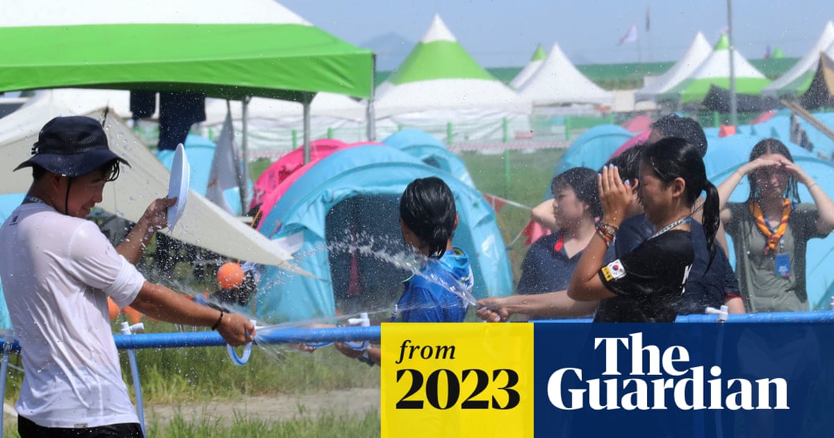 TheSimonBot's tweet card. UK Scouts are being moved to Seoul hotels after heatwave caused chaos and medical issues