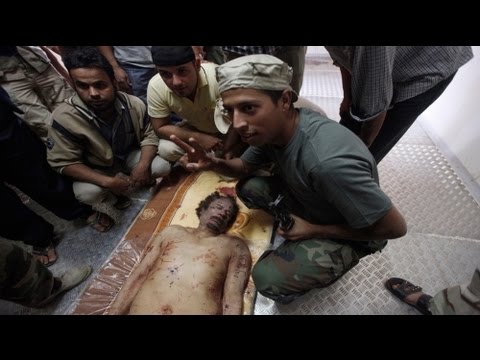 TarikuDuguno's tweet card. The last moments of Muammar Gaddafi