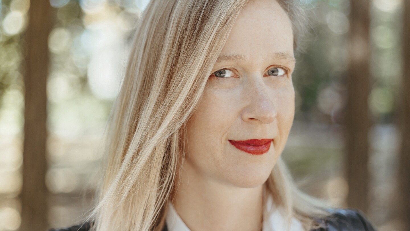 PhysicsToday's tweet card. The astrophysicist turned climate physicist connects science with people through math and language.