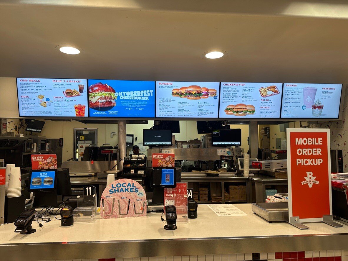 TheHowardCo's tweet card. Burgerville enhances guest experience and operational efficiency by upgrading to digital menu boards, allowing for easy updates and improved communication of seasonal offerings.