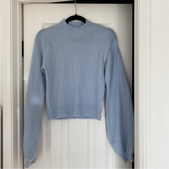 robin_plotnik's tweet card. Target sweater, size small