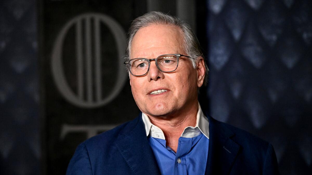 latimes's tweet card. As the auction for Warner Bros. Discovery heats up, the company's board modified Zaslav's contract to consider various deal configurations