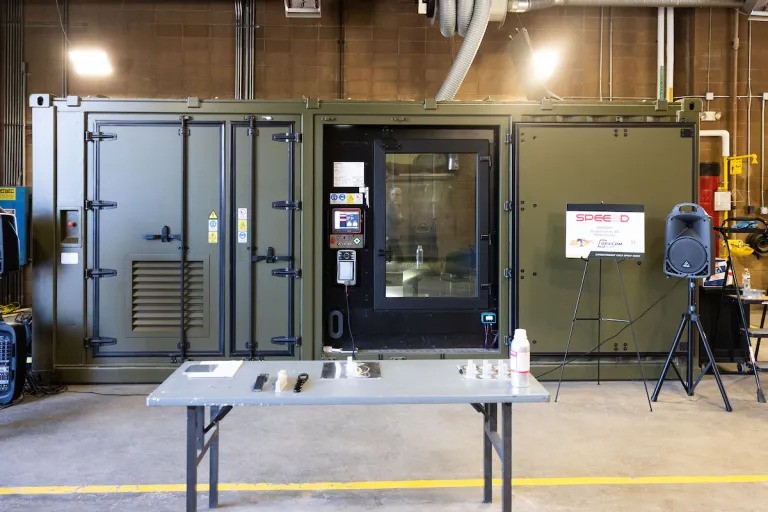 DefensePost's tweet card. The US Army is moving manufacturing closer to the frontline, with a University of Tennessee demo showing units can 3D-print metal parts and drone gear on demand.