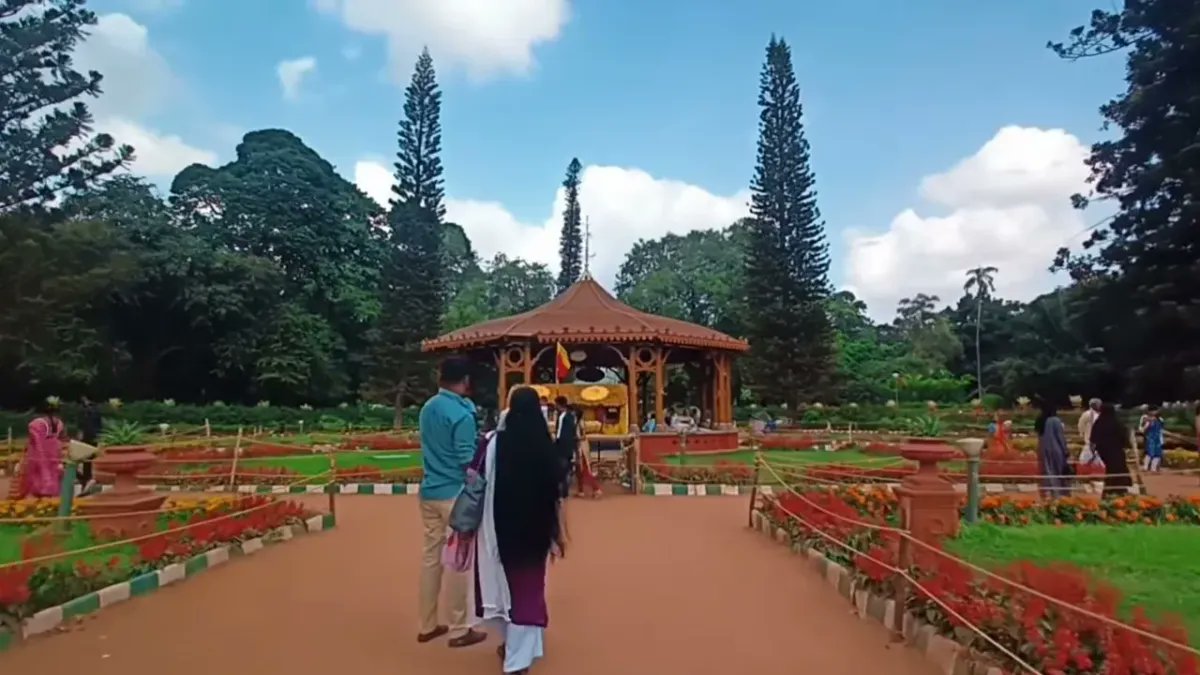 NewsFirstprime's tweet card. Lalbagh prepares to ban reels and wedding shoots to protect wildlife and ensure visitor safety, citing disturbance to birds, greenery and senior citizens. BENGALURU TOP NEWS