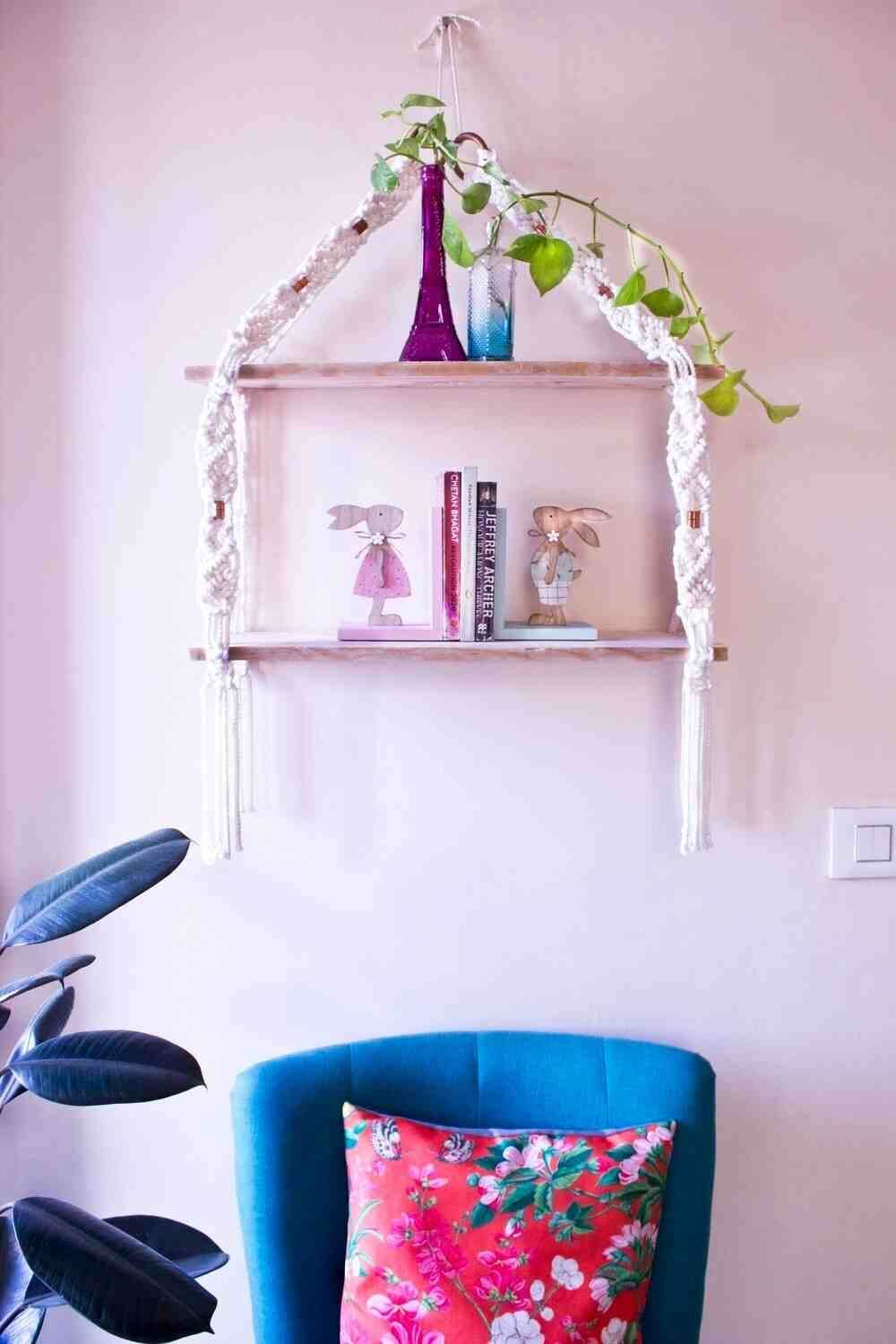 ShopFelicitycom's tweet card. Handcrafted 2-tier macramé wall shelf with natural wooden planks, perfect for books, plants, and home décor styling.