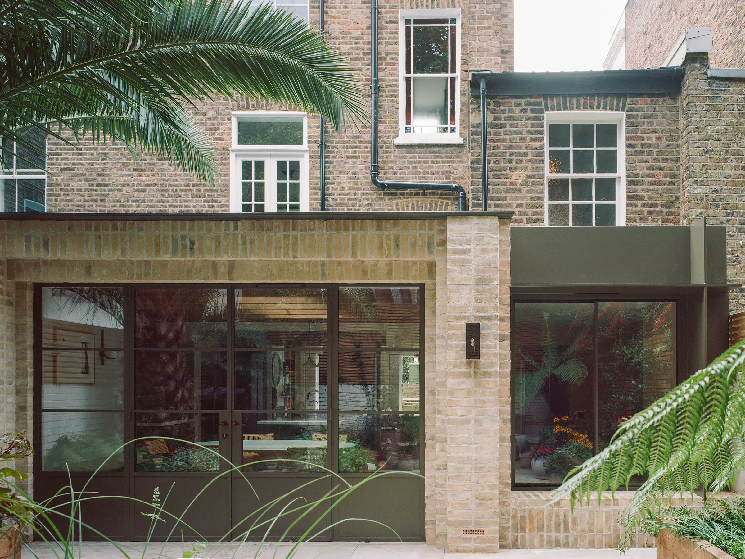 urdesignmag's tweet card. Studio McW transforms a Victorian London home with a monolithic brick extension, creating a flexible lower-ground hub for contemporary living.