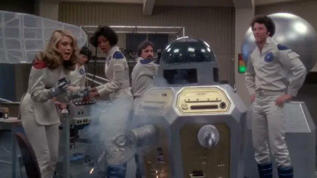 fireballil's tweet card. In the theater, Emily's crew watches as three people and their robot friend try to put a stop to an evil plot to destroy the colonies living on the moon in H.G. Wells' THE SHAPE OF THINGS TO COME...