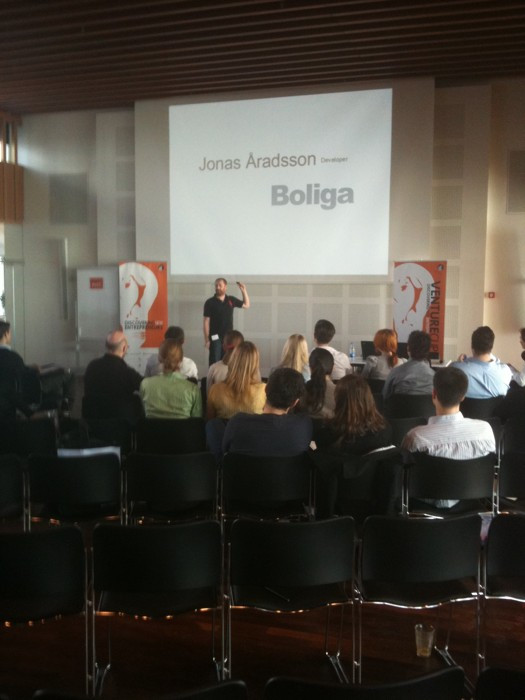 Angggie's tweet card. So @JonasWho has taken the stage now at #vcc .. WITH slideshow! (cc @Boliga) #developersrock