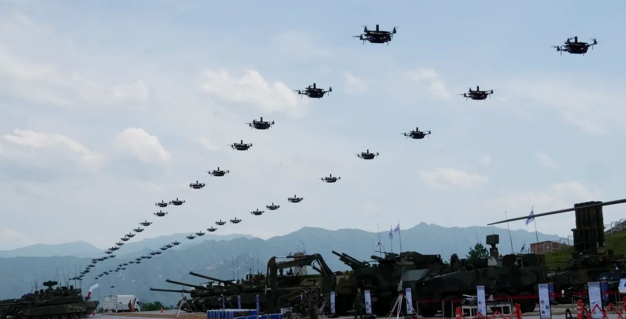 DefensePost's tweet card. Small drones will soon fill Ukrainian skies to create a first-of-its-kind “drone wall” system to shield infrastructure from Russian strikes. 