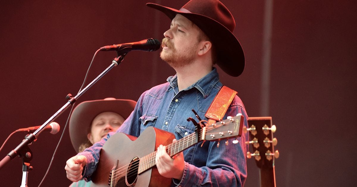 KyleCoroneos's tweet card. Colter Wall doesn't just play the music, he champions it. He embraces it. He sells its virtues to the audience. That's what Colter does for traditional country songs on "Memories and Empties."